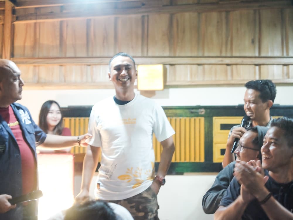 Members of a community club gathered together indoors