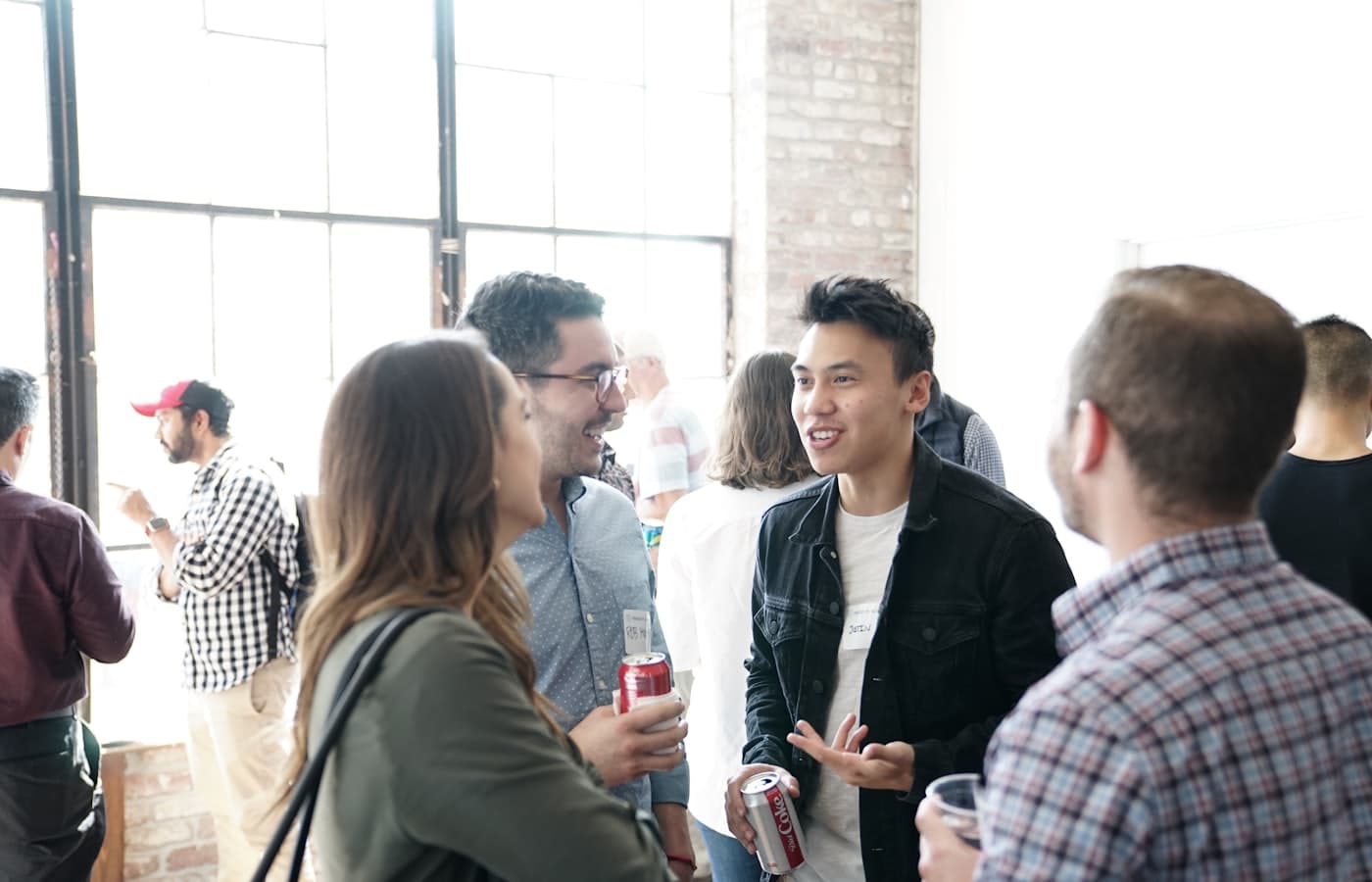 Members talking at a bright networking event